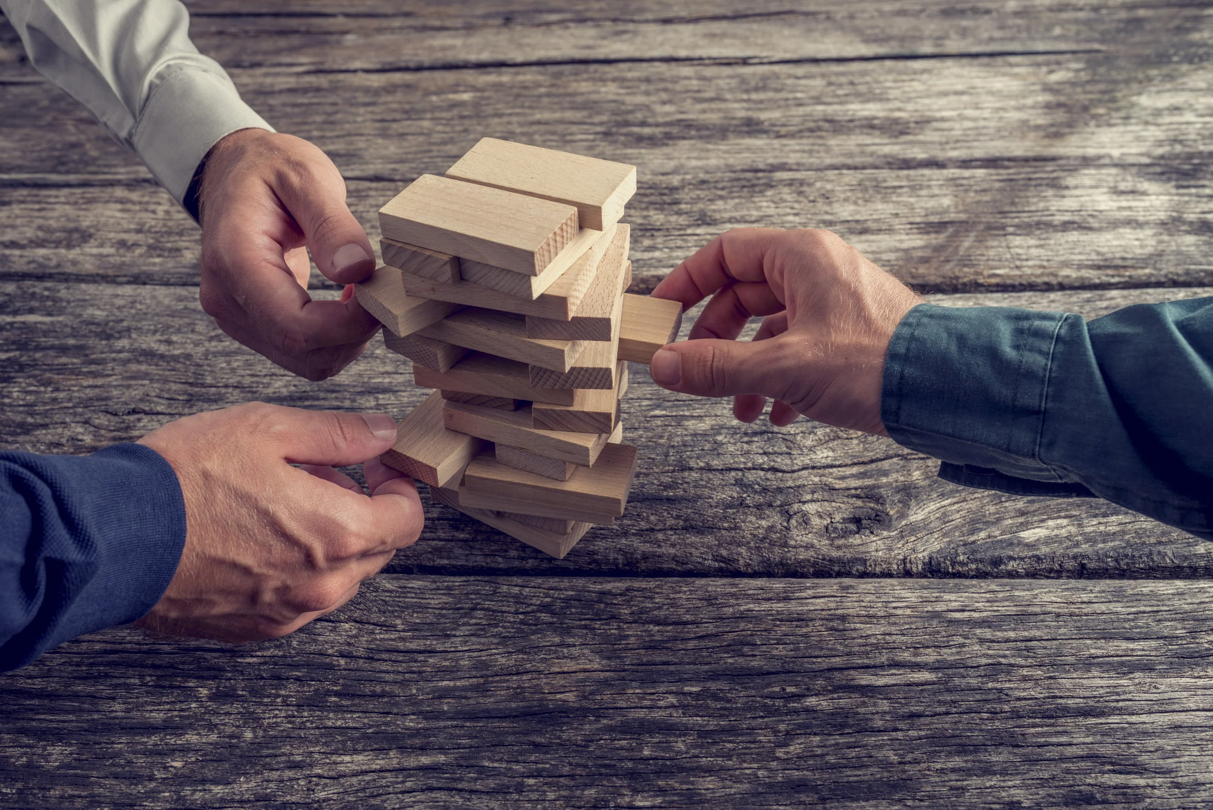 shutterstock_314177438_hand_jenga.jpg