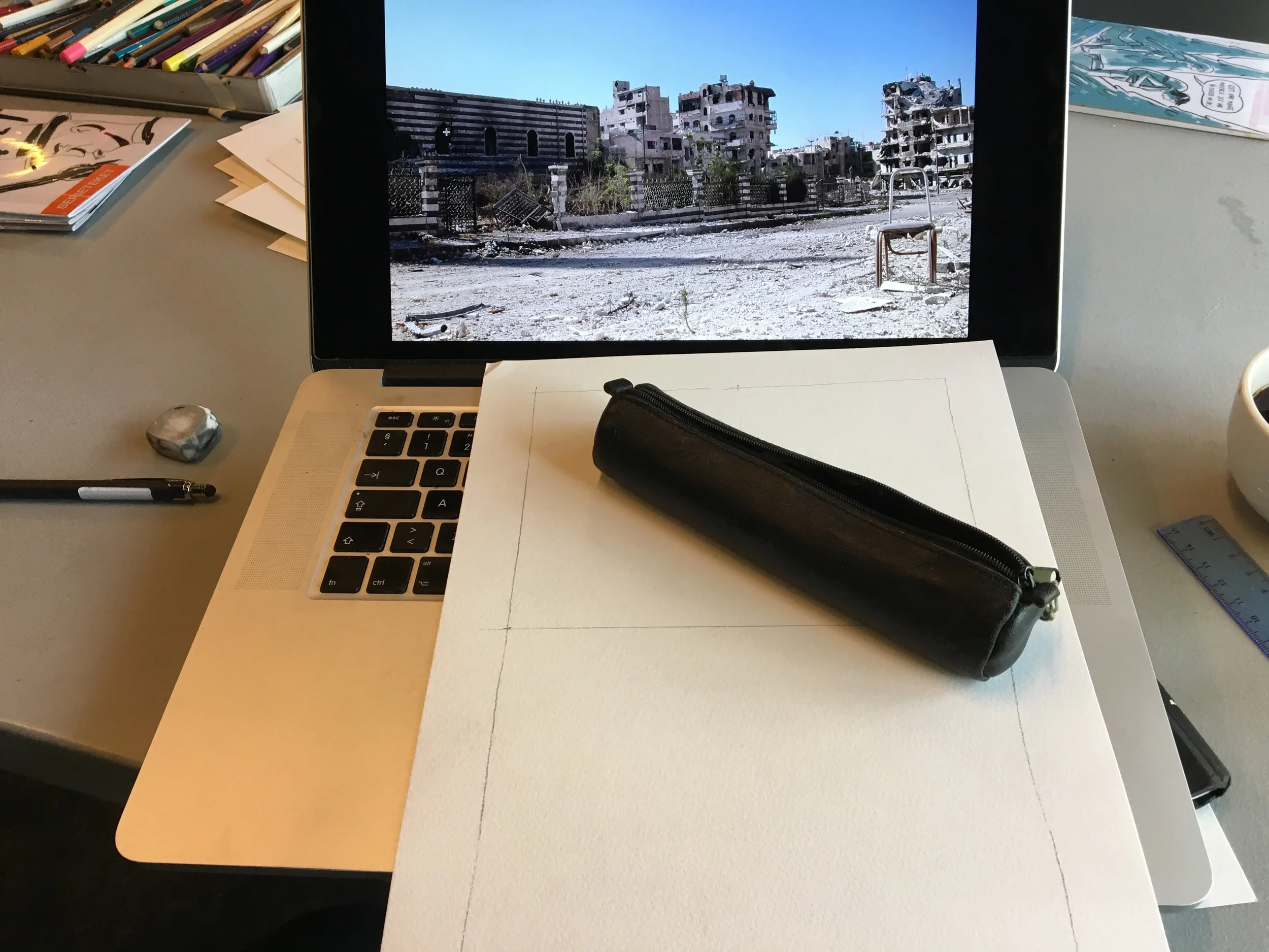 The torturing blank page, a cup of coffee and a reference photo.