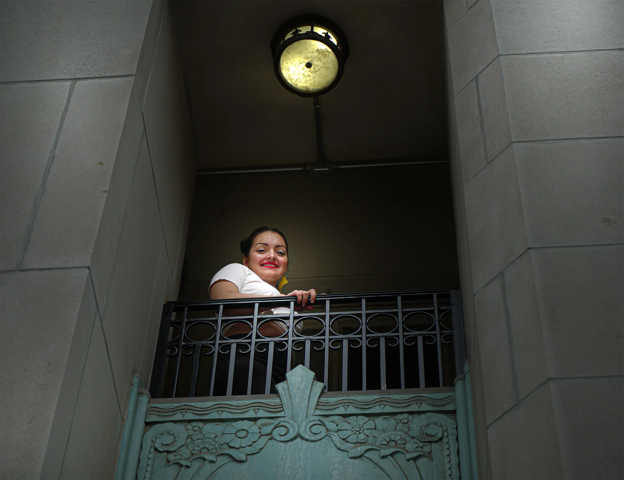 Amanda-Casandra-fashion-designer-on-balcony-at-The-Last-Hotel-in-St.-Louis.jpg