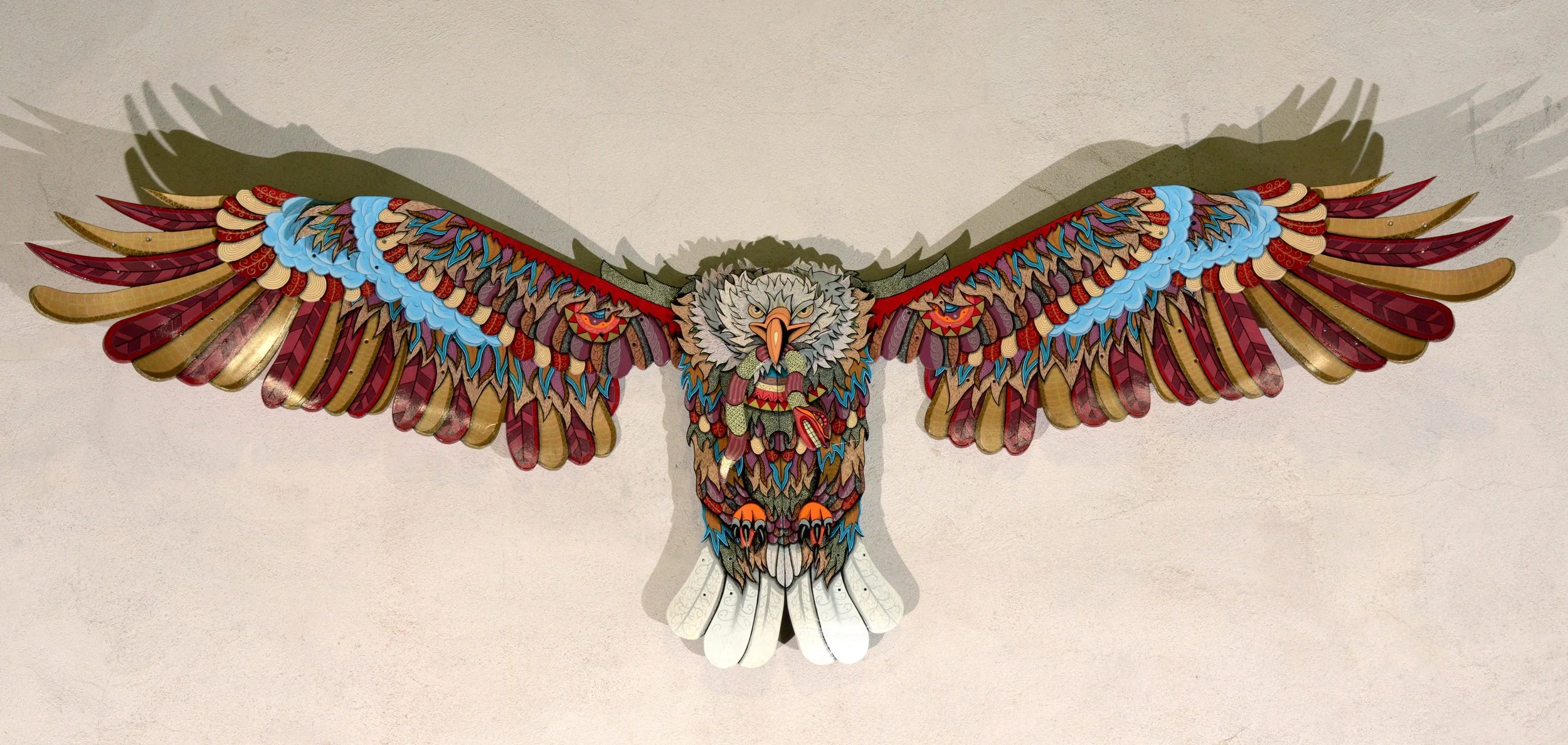  Eagle DF &nbsp;XVI  Sculpture made with 15 skateboards, painted with oil and Poscas. 80X250 cm ,&nbsp;05/2016. &nbsp;OUT 