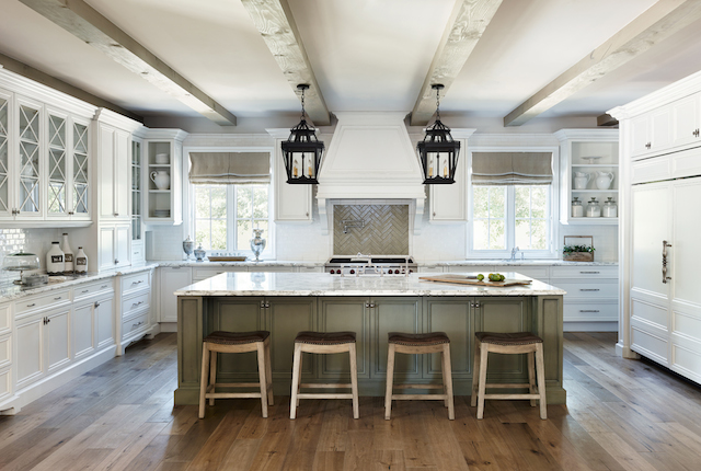The laundry room carries the theme from the kitchen and features a farmhouse sink.