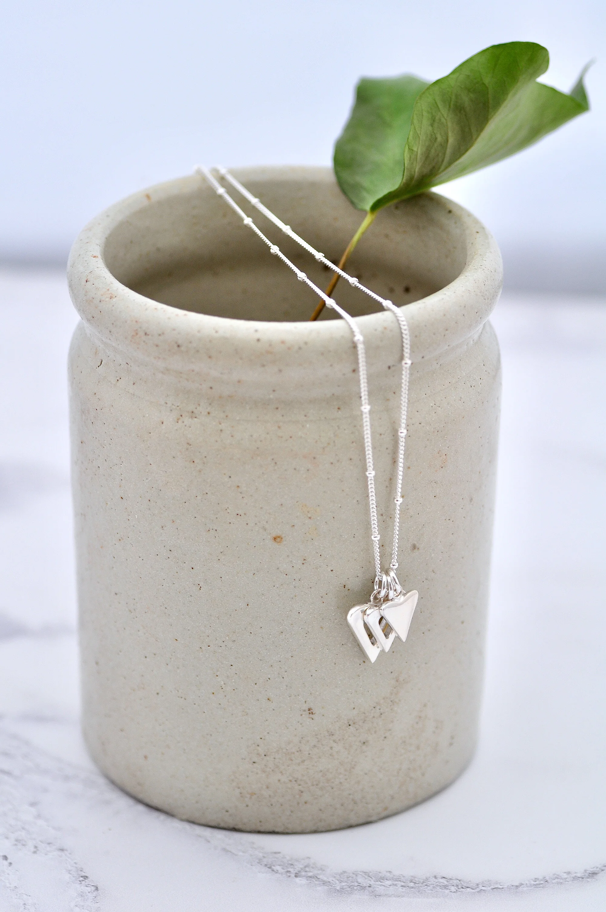 Triple heart necklace_hanging.2000.jpg