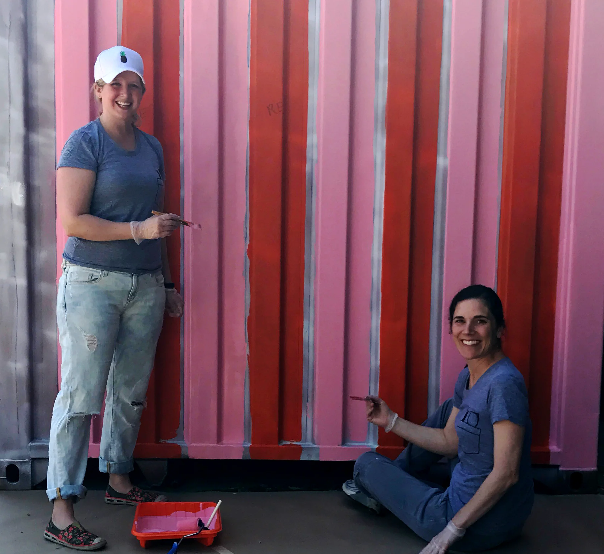 Leo Burnett Chicago employees paint a structure outside of the Off the Street Club in the West Garfield Park neighborhood of Chicago.