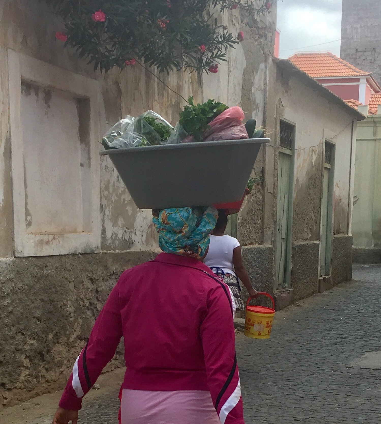 Cape Verde women carry baskets on heads