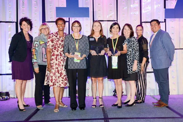 Winners of the Parent Educator of Year awards pose with PAT board members and staff at the 2018 international conference in Phoenix, AZ. From left are: P.J. West, board member; Patricia Kempthorne, board chair; Constance Gully, president/CEO; Parent Educator of the Year recipients Maria Arroyo, The Parenting Center of Lexington, SC; Kristina Gorshe, Catholic Charities Diocese of Pueblo, Pueblo, CO; Cindy Boger, Parents as Teachers of Catawba County Hickory Public Schools, Hickory, NC; Kerry Caverly, VP, program and implementation support; and board members Renee Welch and Francis Vigil.
