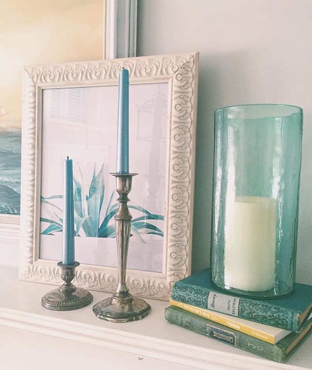 Tidbits of things that mean something to me are all over our home...Blues, scenes of the sea, oil paintings, antique books used in our wedding decor, candlesticks for my sister's wedding, and joy-filled images of our loved ones. To me, it's important