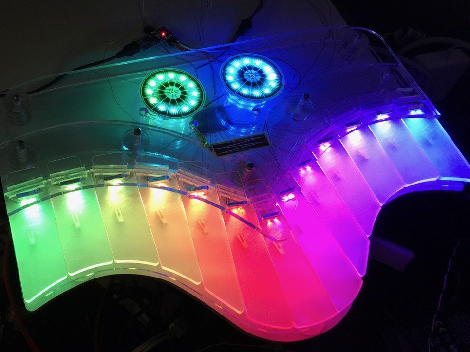 Light test of the assembled result, hinges created out of polycarbonate flaps, touch sensors mounted. It really came out better than I could have hoped for!