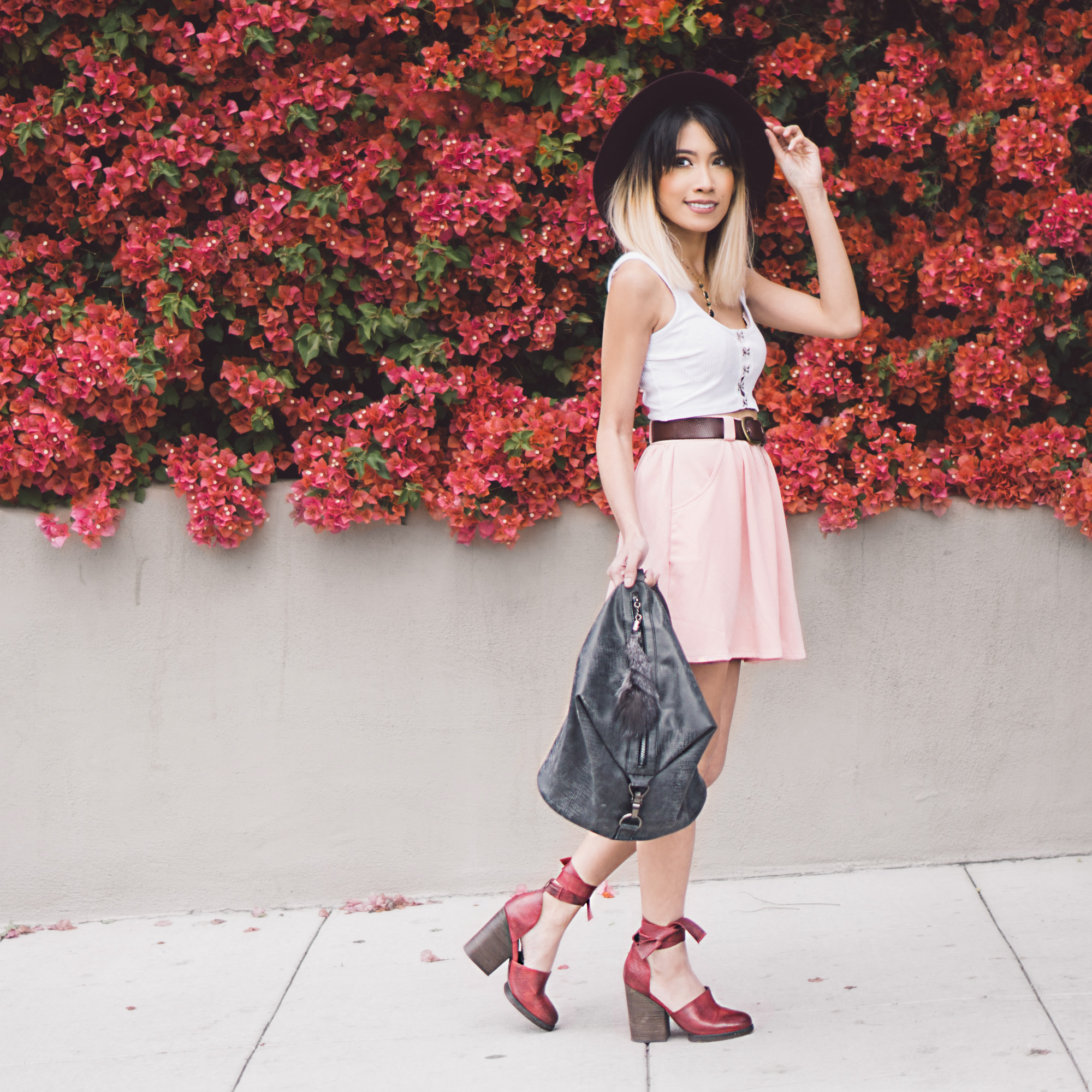   Hat :  Billabonog    Top :  Sunny Afternoon Cropped Tank Top    Skirt : (similar)  Myah Pleated Skater Skirt    Bag :  Cassi Draped Backpack Black    Shoes : (similar)  Cora Wrap Heel  