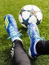 Messi Ball Grass Boots.jpeg