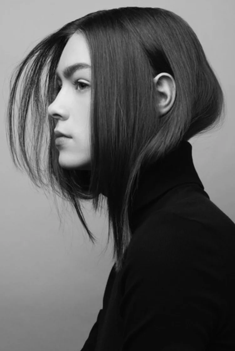 Black and white fashion portrait with a precise chin-length bob and black turtleneck