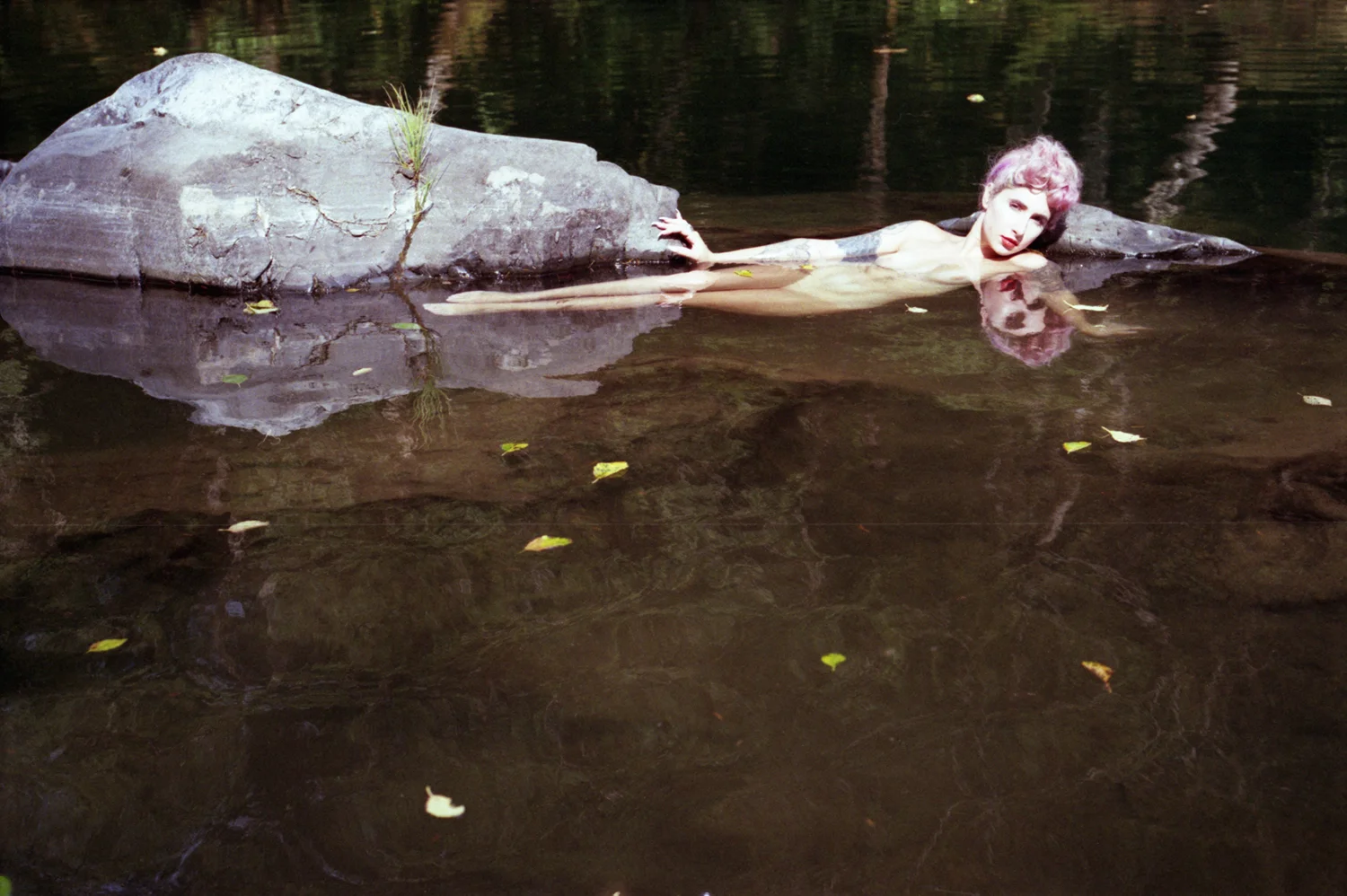 Ana full body among rocks with reflection, bleached out.jpg