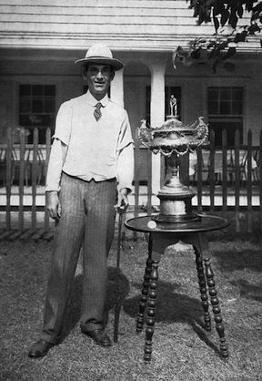 Resting next to the 1901 U.S. Amateur trophy is an early rubber-cored ball that Walter Travis used to win the championship.