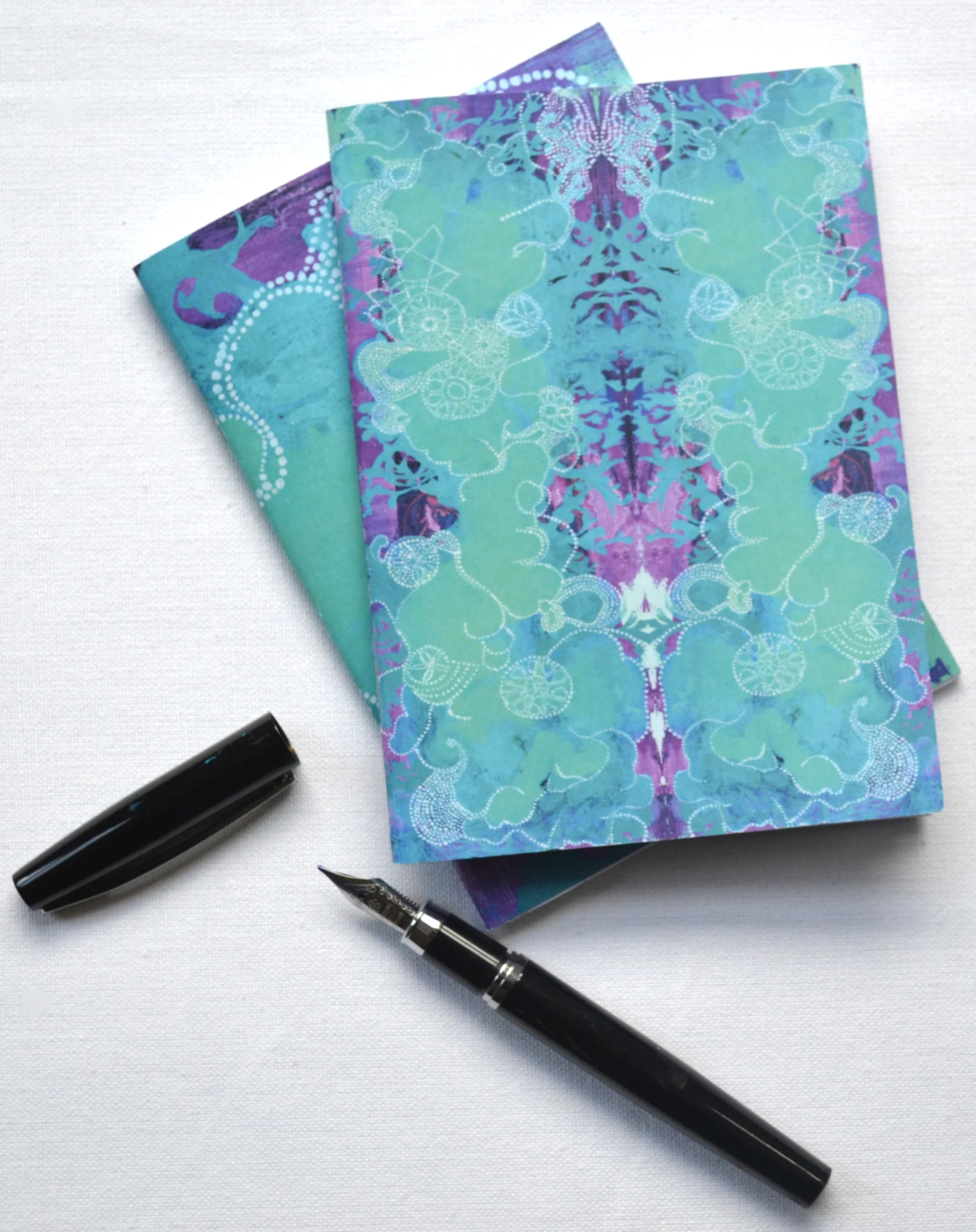 Two notebooks_with pen.jpg