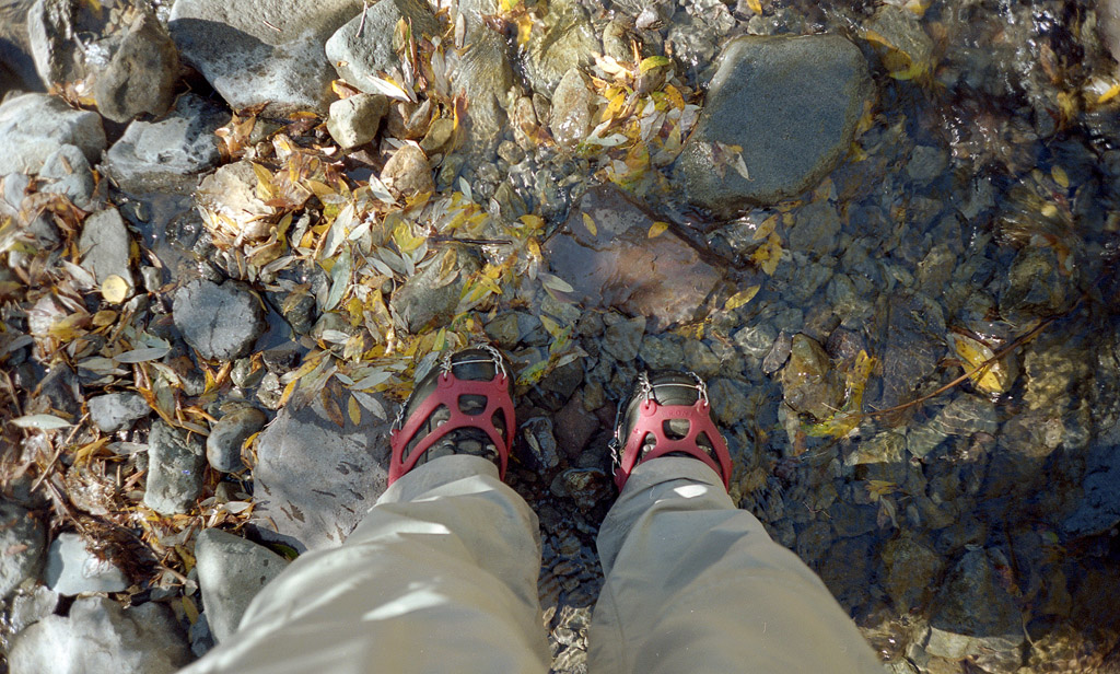 My ice cleated boots as I walk through a stream