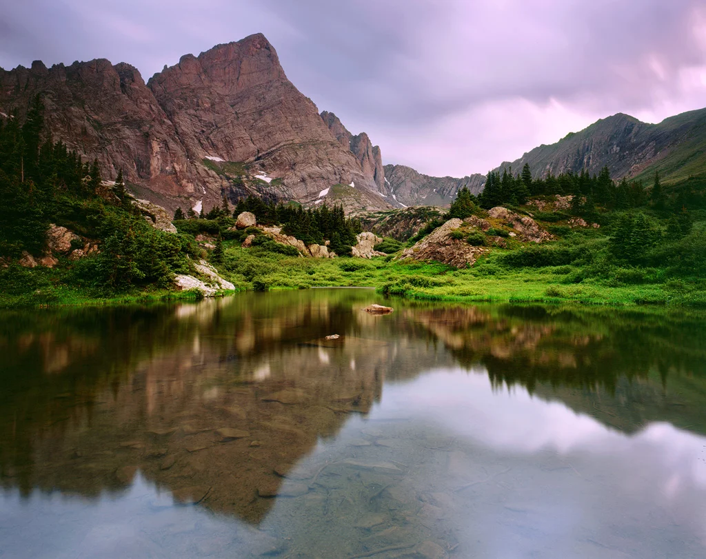 Crestone Needle reflects in twilight hues. A view you'll likely only see if you're backpacking.