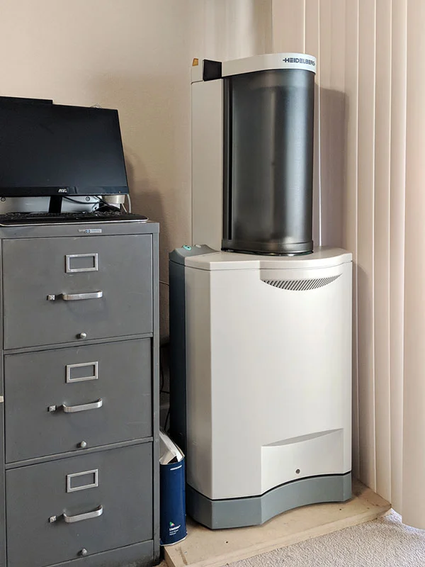 Tango Drum scanner with PowerMac hiding behind monitor on filing cabinet