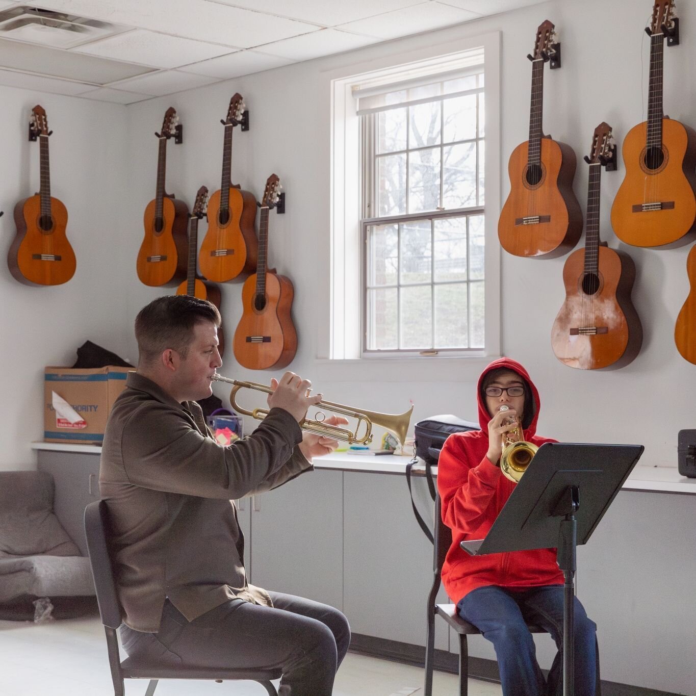 Musicians Tommy Lehman (trumpeter and vocalist) and Jonah Ferguson (guitarist) worked with jazz band students as part of Curated Storefront's Artist Residency Program at the I Promise School. Lehman, an Akron native, and Ferguson, a Cleveland-based a