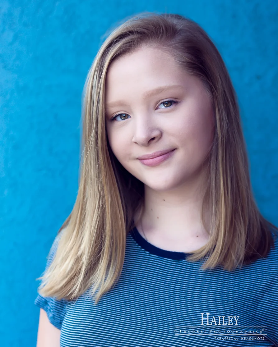 This blue is so vibrant that it just actually seems to want to blend in with Hailey's shirt!