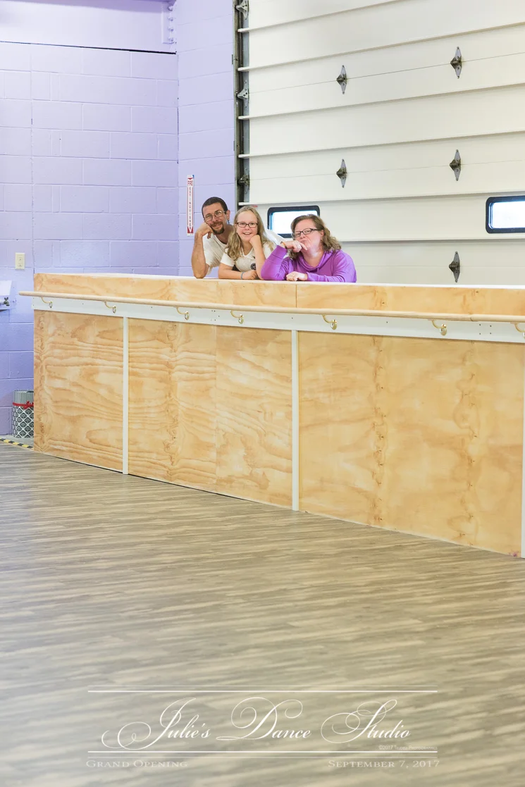 The barre has three different levels for the ballet dancers to stretch and practice on. Julie strikes a pose with the man who created the barre structure (and his daughter). On the other side of the room are the many mirrors.