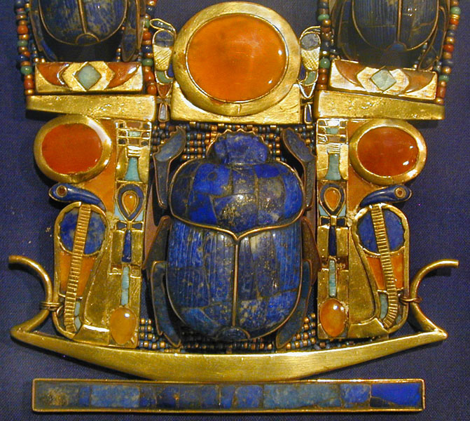 image: detail from necklace found in the tomb of Tutankhamun, Wikimedia commons ( link ).