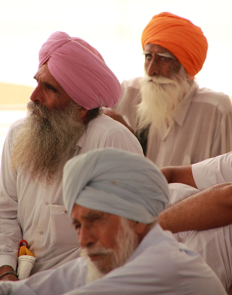 Sikh men (hair is traditionally unshorn and coiled beneath turban in a Rishi knot). Wikimedia commons ( link ).