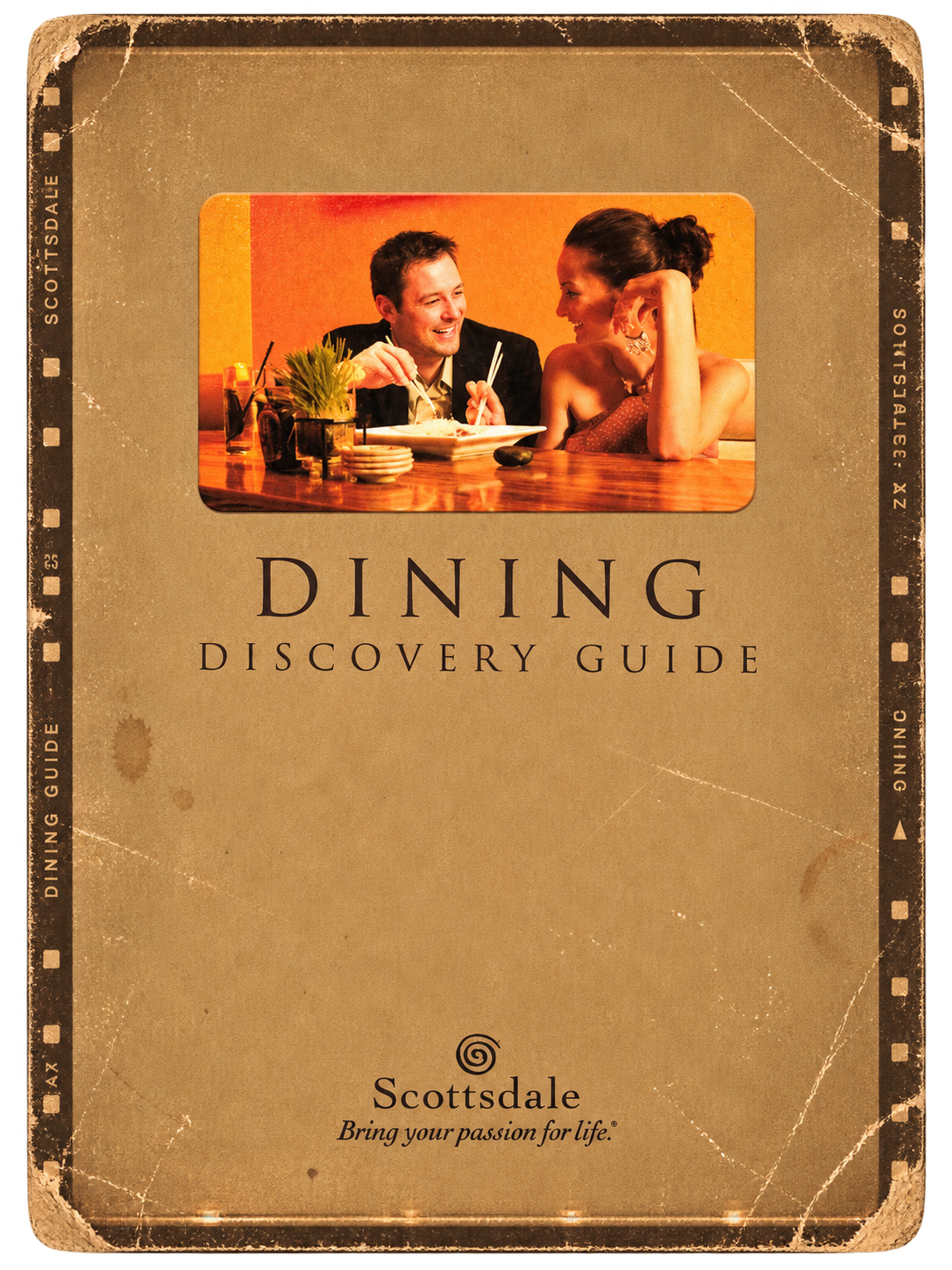A guide cover titled 'Dining Discovery Guide' featuring a photo of a man and woman enjoying a meal together in a restaurant, with a warm, cozy atmosphere.