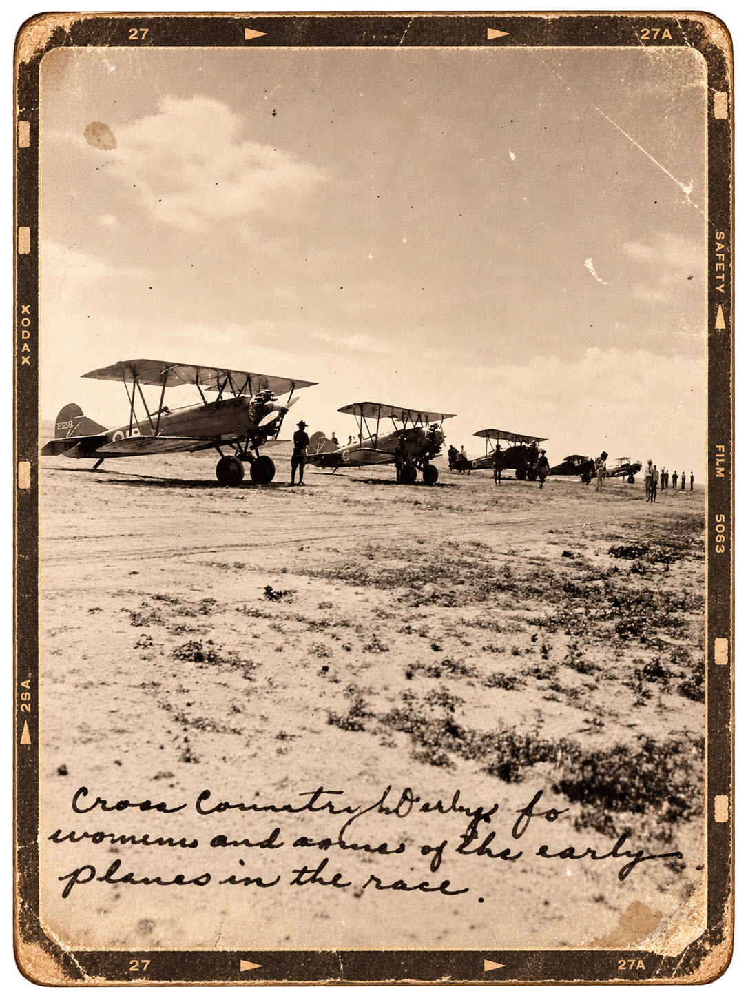 Historical black-and-white photo of vintage biplanes lined up on a dirt airfield with people standing beside and around them, under a partly cloudy sky.