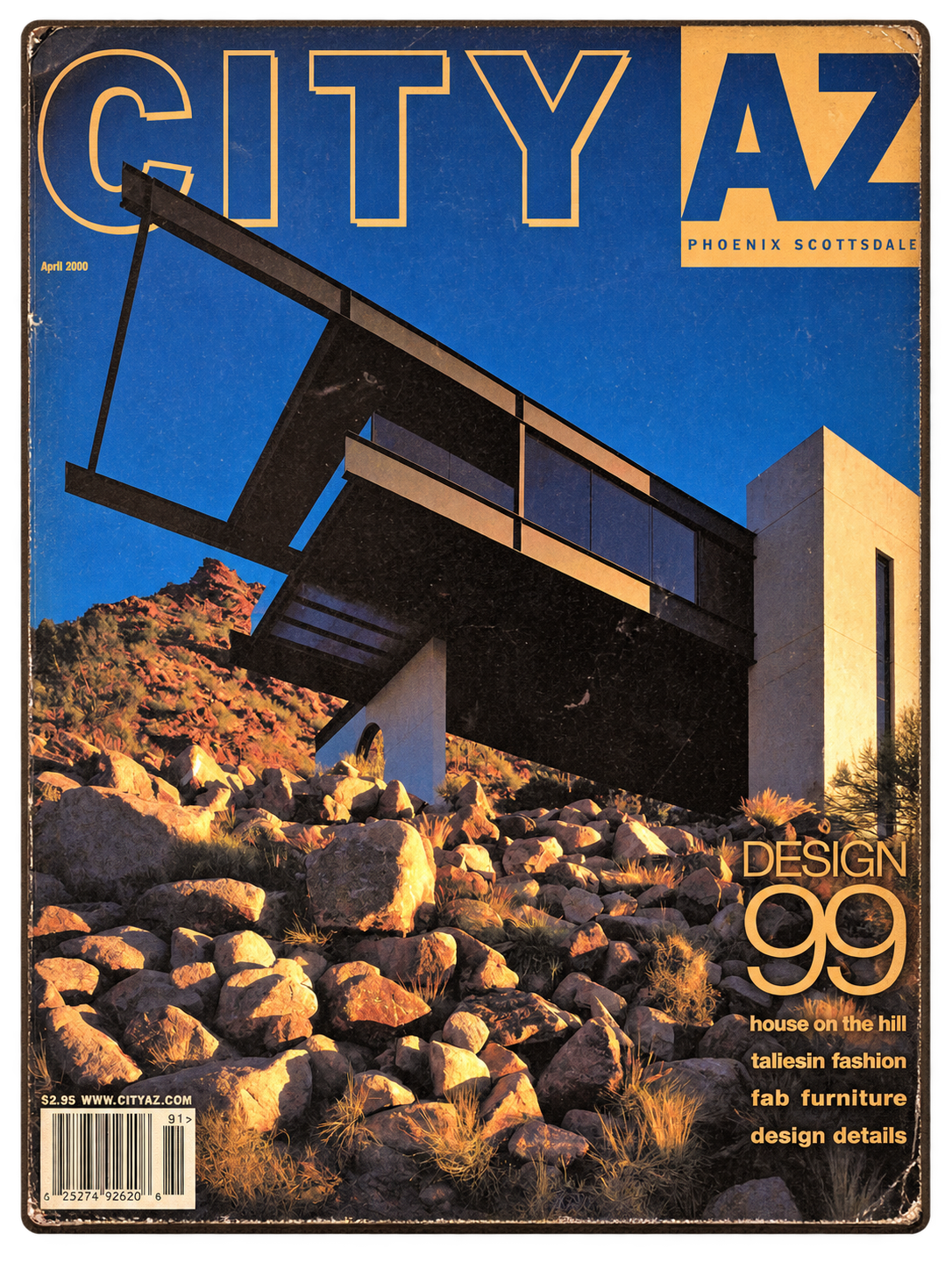 Cover of a magazine titled 'City AZ' featuring a modern house on a hill with rocky terrain, under a clear blue sky. The magazine highlights architecture, design, and fashion from April 2000.
