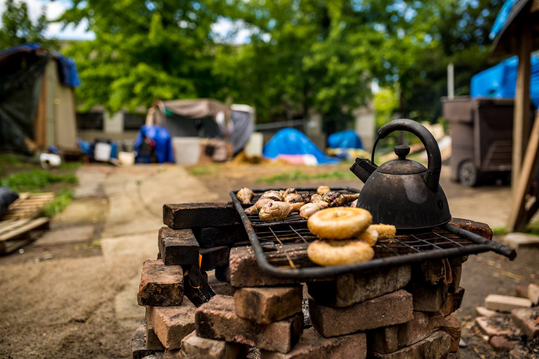 Dinner at houseless camp, Forgotten Realms, in June, 2016. Portland, Oregon. Photo courtesy of The Miller Scholarship Foundation.