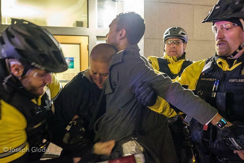 Kathryn Stevens and Gregory McKelvey of Portland's Resistance get arrested for peacefully protesting in Portland. Photo by Joseph Glode.