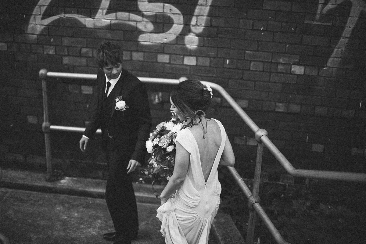 Bride and groom with graffiti