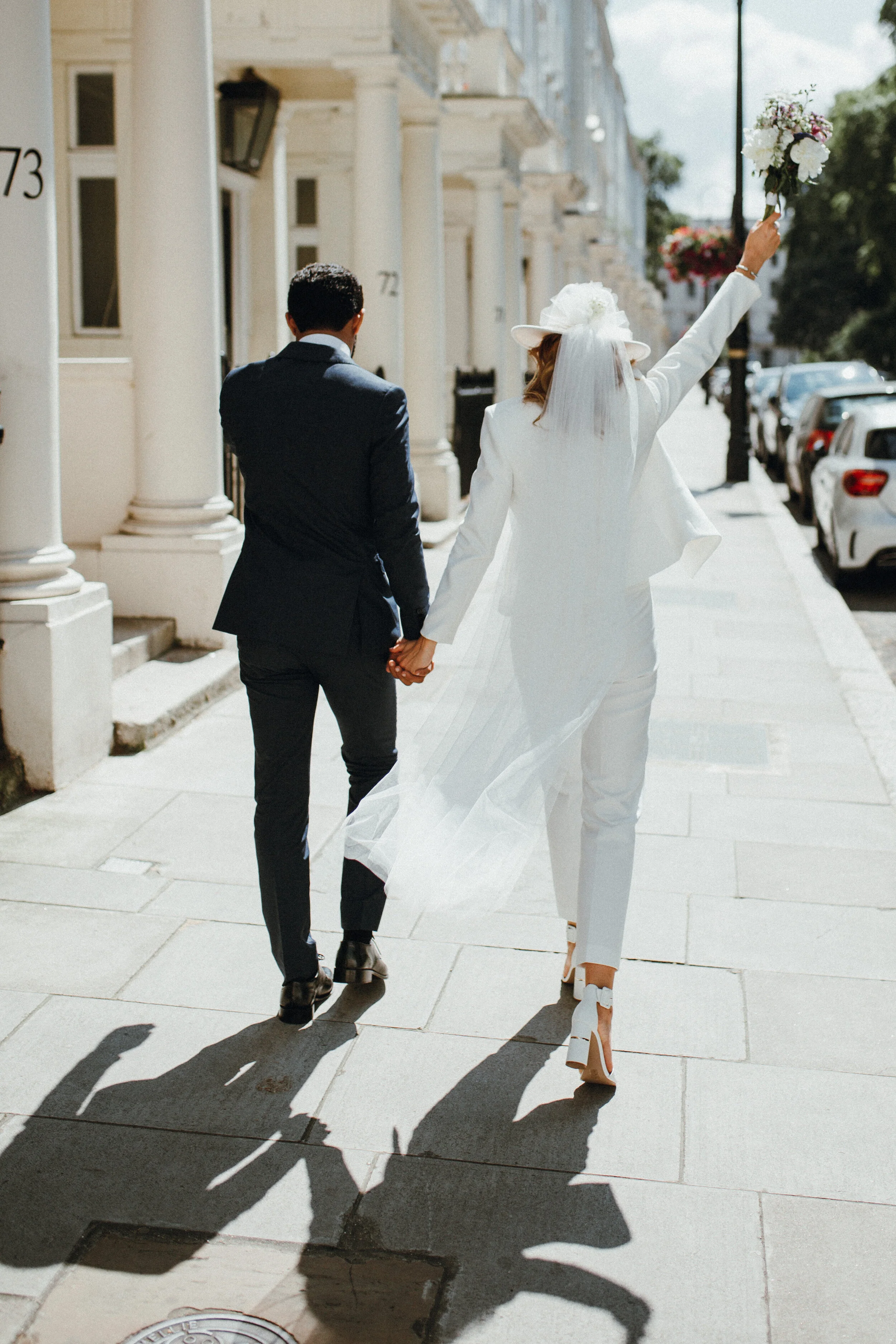 Bride in suit London wedding photographer