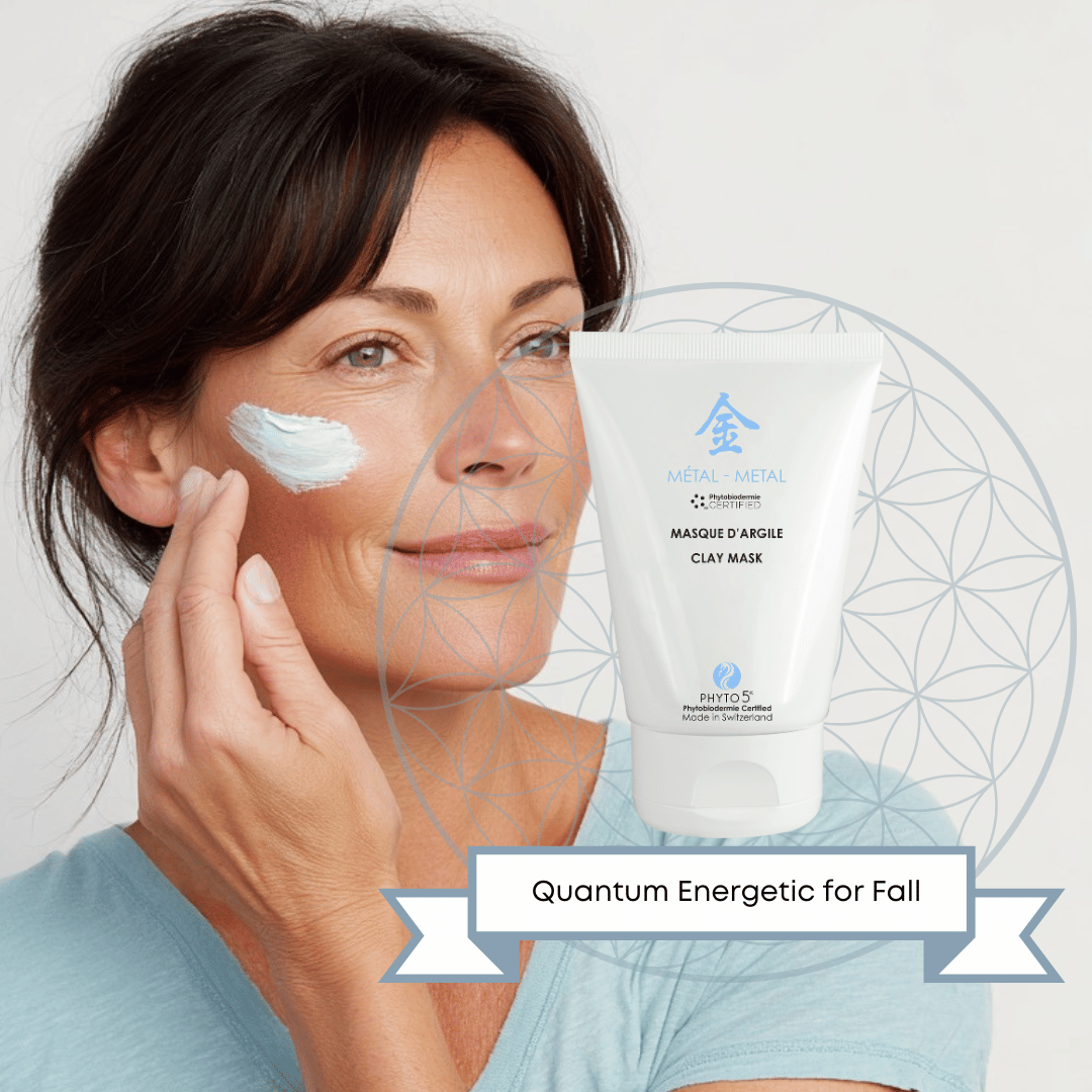 A middle-aged woman smears a large dollop of Metal white Clay Mask onto her cheek