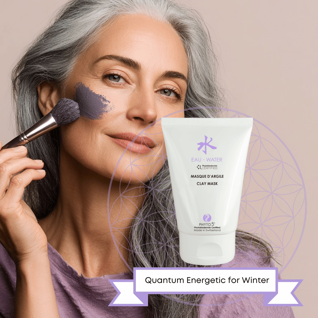 A mature woman brushes Water element black Clay Mask to her cheek