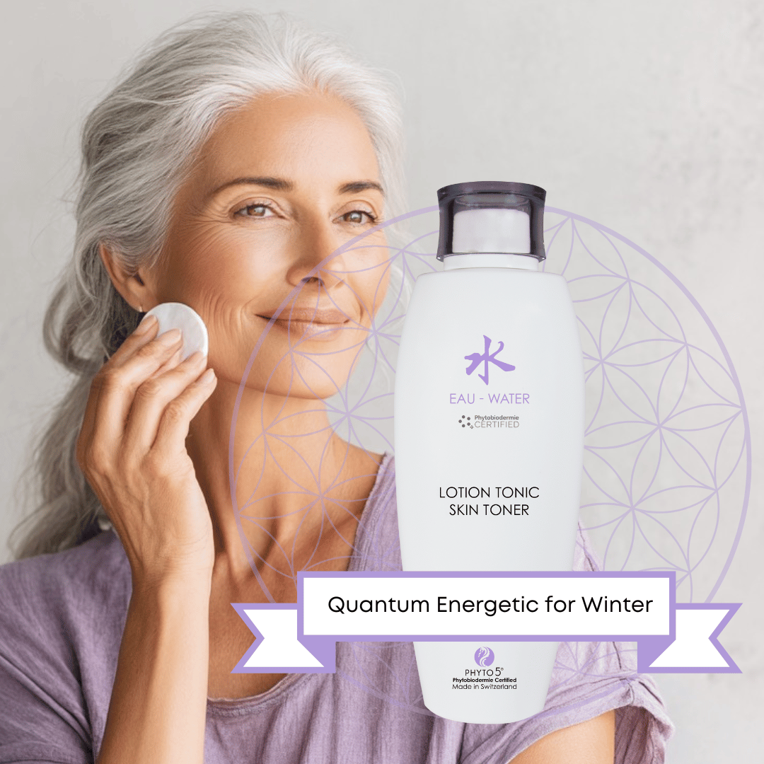 A mature woman swabs her face with a cotton pad moistened with Water element skin Toner