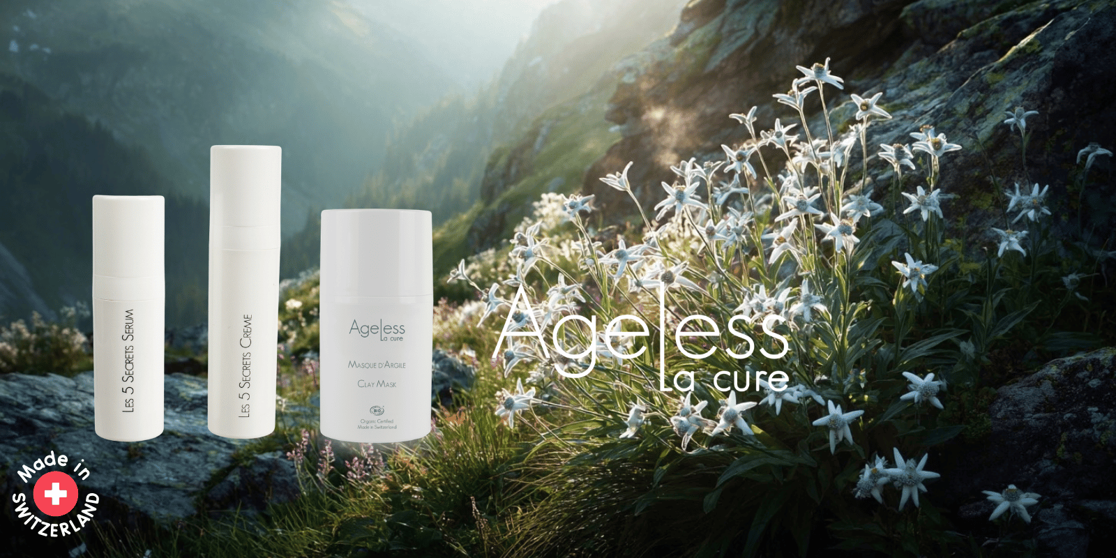 Three Ageless line products against the backdrop of Swiss Jura Mountains and a field of Edelweiss blossoms