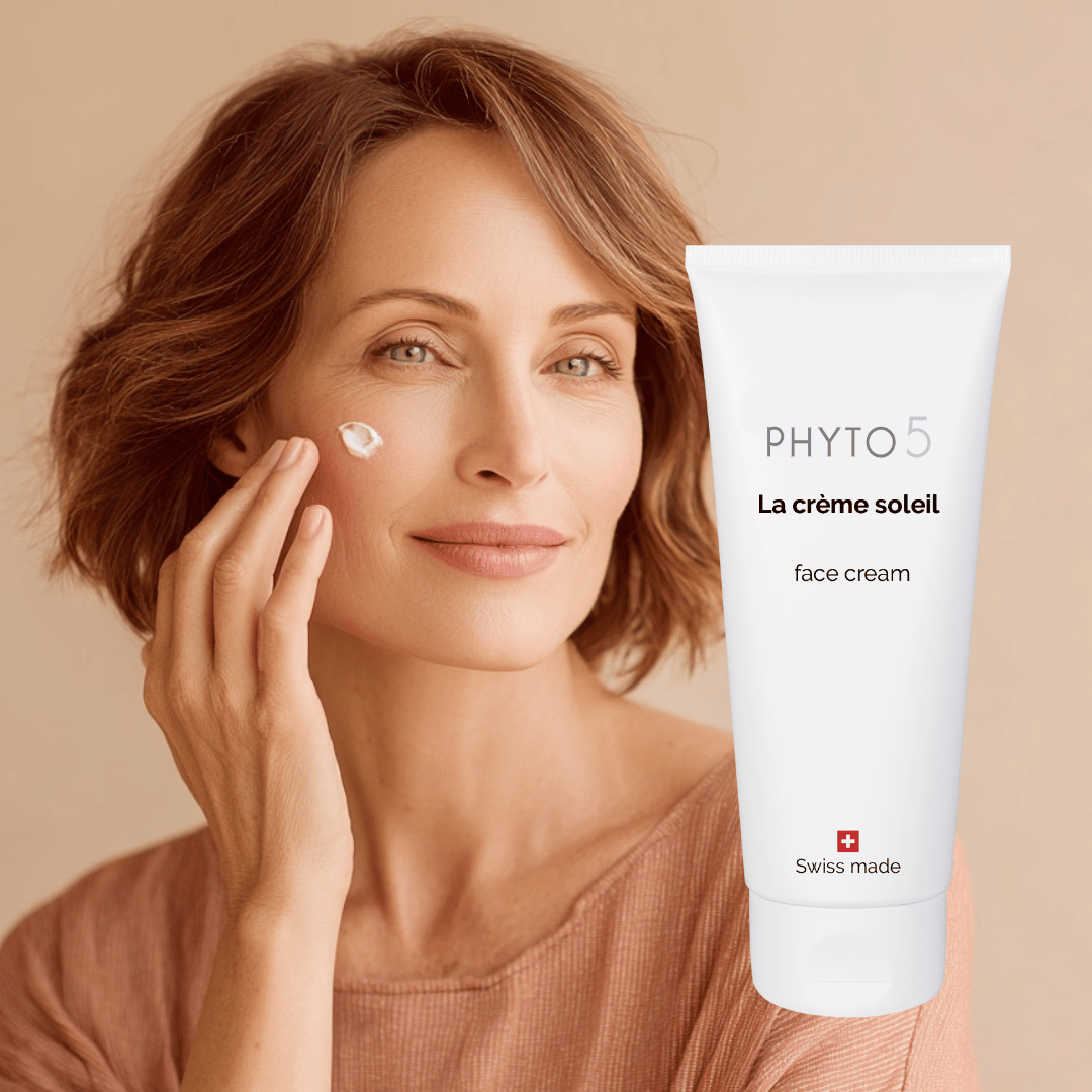 A woman applies a small amount of Face Cream Soleil to her face