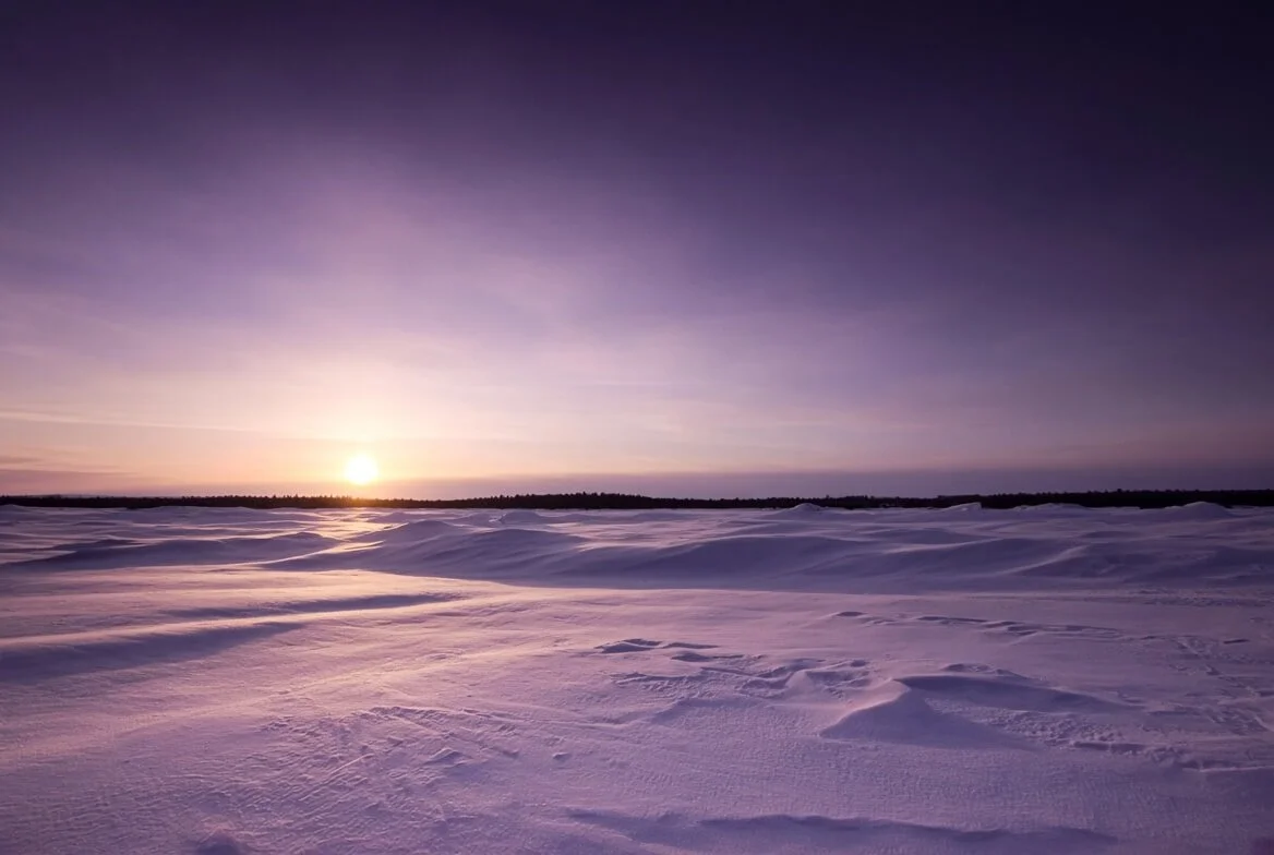 Winter solstice spiritual meaning in a low lavender sunset over snow, the hush at the heart of TCM’s Water season.