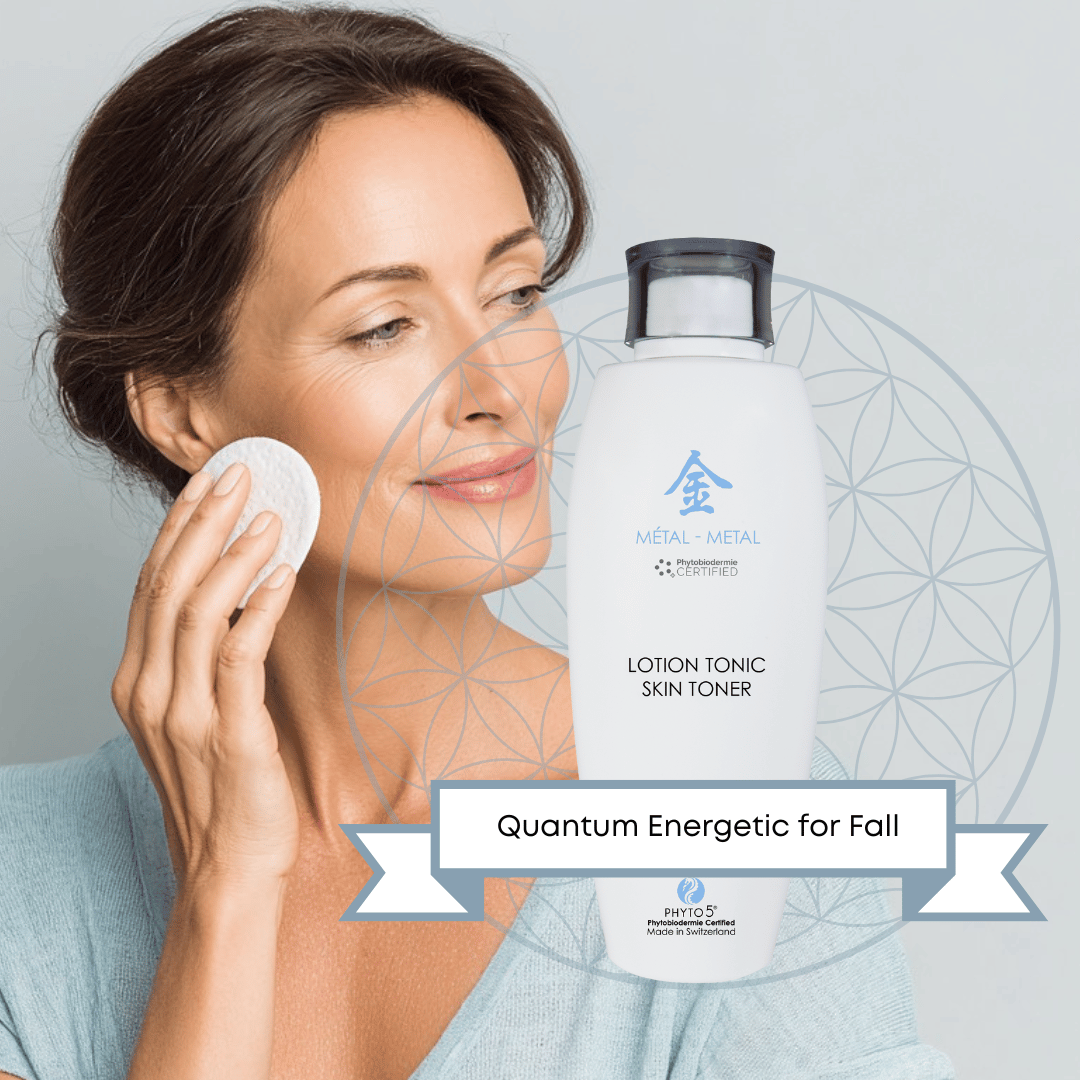 A middle-aged woman swabs her cheek with Metal element skin Toner