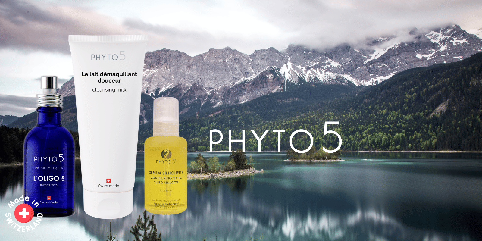 A serene glassy Swiss lake with mountains in the background and three select Swiss line skincare products in the foreground