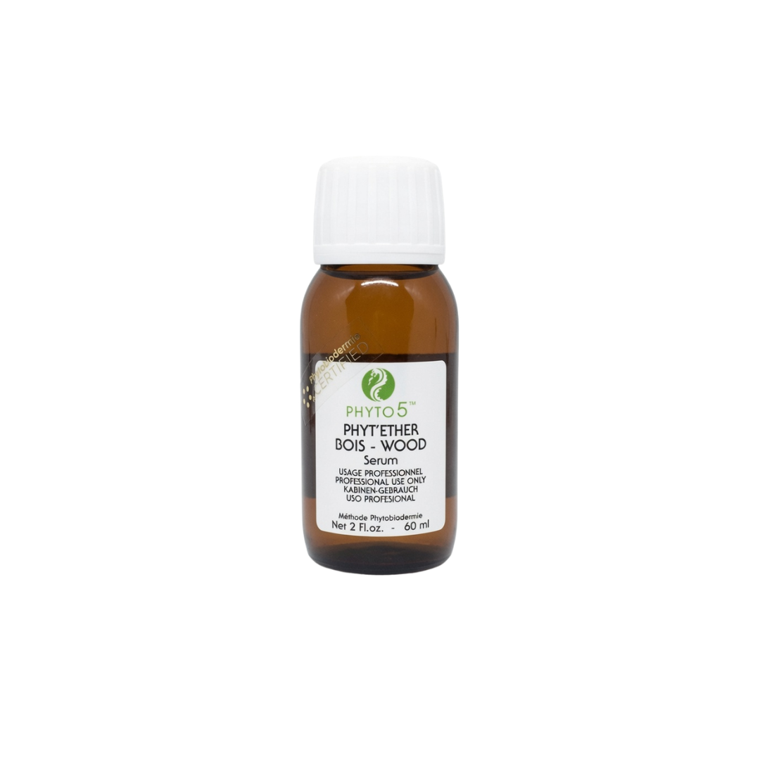 A bottle of Wood element Phyt'Ether serum with green accent labeling
