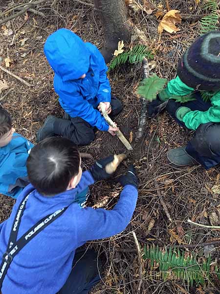 Digging a hole for the shelter ridgepole