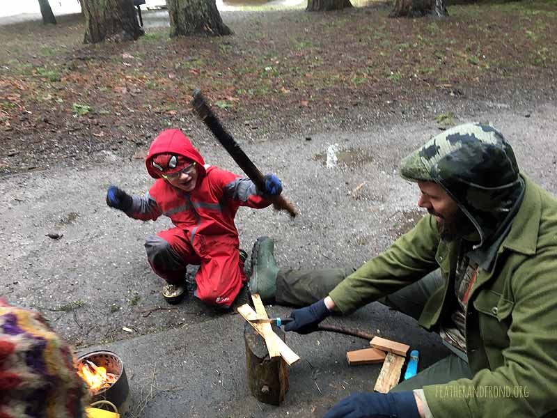 Boppin' wood for our afternoon fire on a very cold and wet day!
