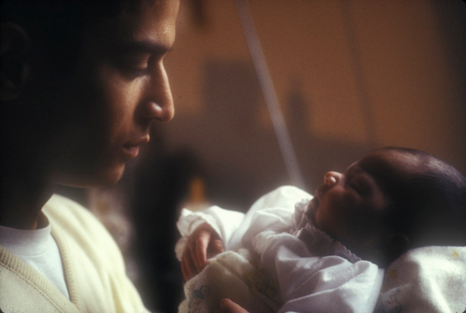 Baba, Vickie's husband, with their newborn baby.