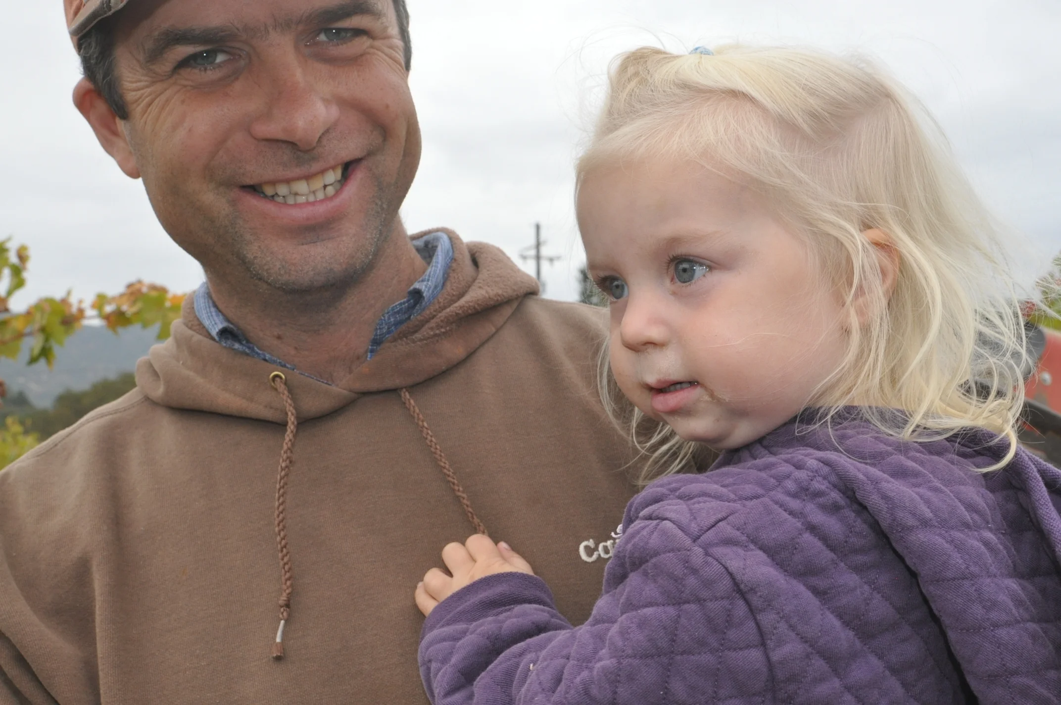 Pete Johnson with daughter Gwendolyn in the Redwood Valley vineyard.