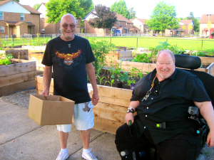 Jack & Robert after purchasing plant starts at the community plant sale.