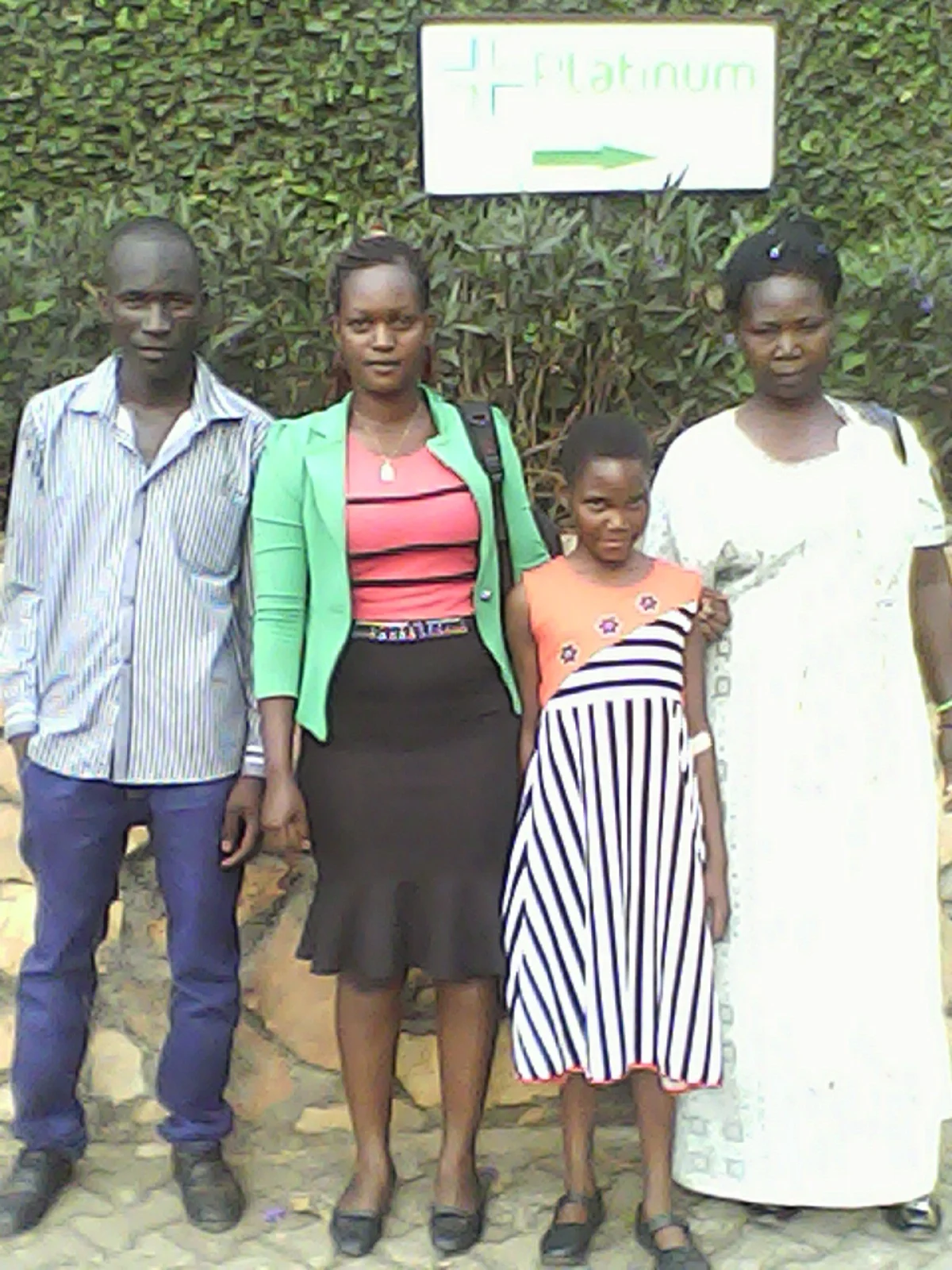 Left to Right: Posiano - a Tusubira beneficiary needing corrective surgery, Prossy - Tusubira alumni in nursing helping to lead this medical project, Daphne - a Tusubira scholarship recipient also needing corrective surgery, and Daphne's aunt.