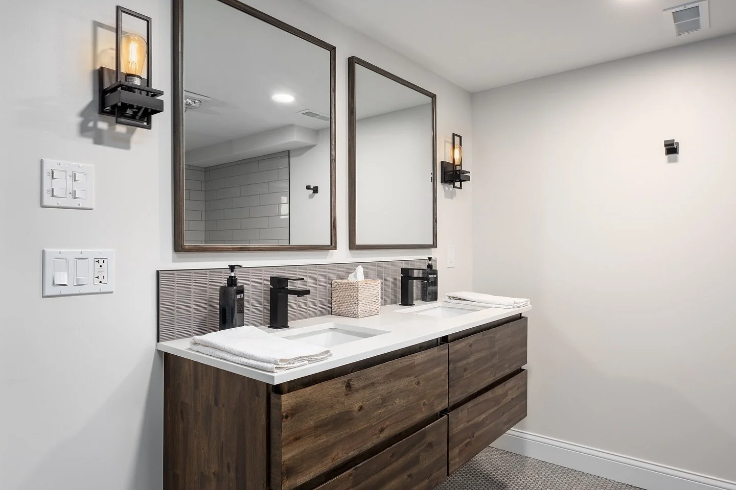 Sleek. Simple. Sophisticated. 🖤
This Chesterfield bathroom remodel features a timeless mix of warm wood tones, matte black fixtures, and clean lines throughout. The open shower design and floating vanity create a modern, spa-like feel &mdash; all cu