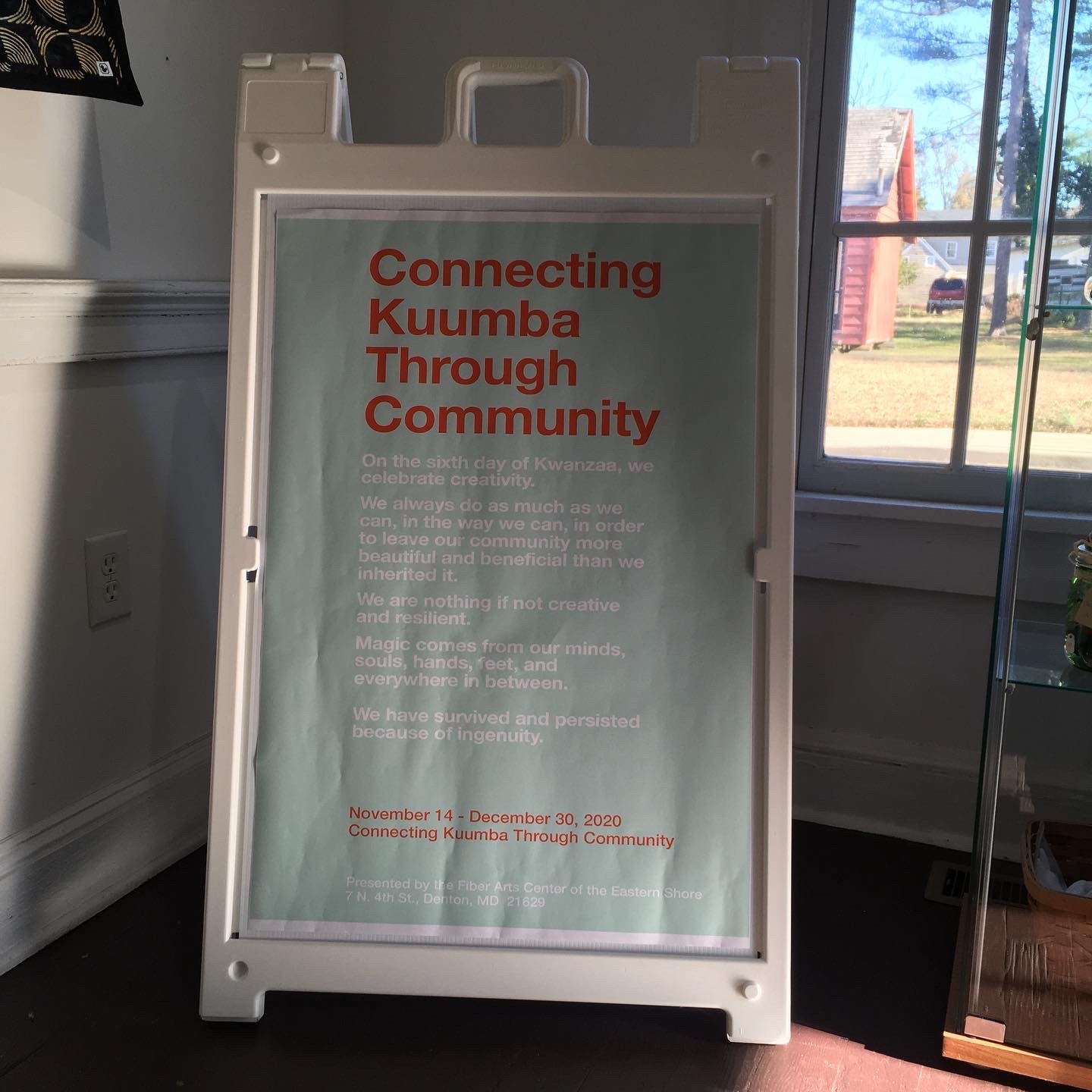 Connecting Kuumba Through Community Exhibit Sign