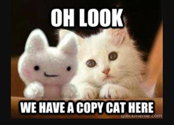 Meme with a white cat and a stuffed animal cat that says "Oh look, we have a copy cat here"